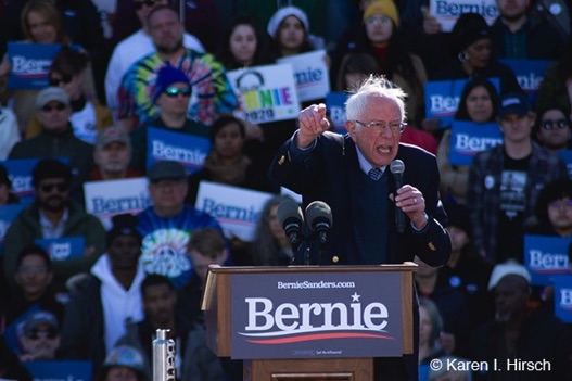 Bernie Sanders emphasizes a point from the podium